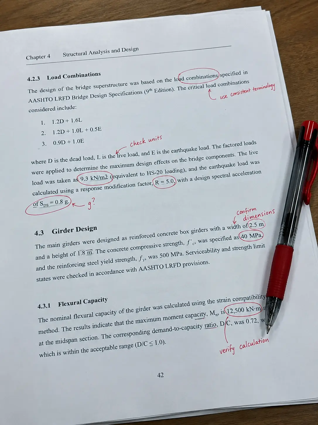 A civil engineering thesis manuscript with red-pen annotations correcting terminology and units
