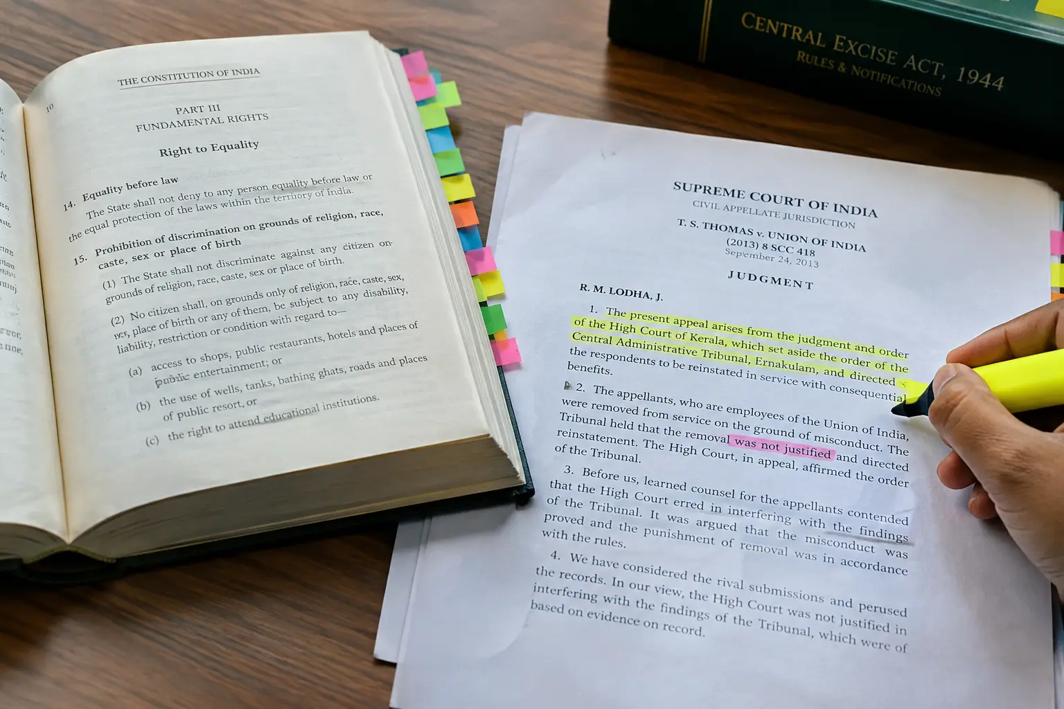 A hand annotating a printed court judgment with a highlighter during legal dissertation research